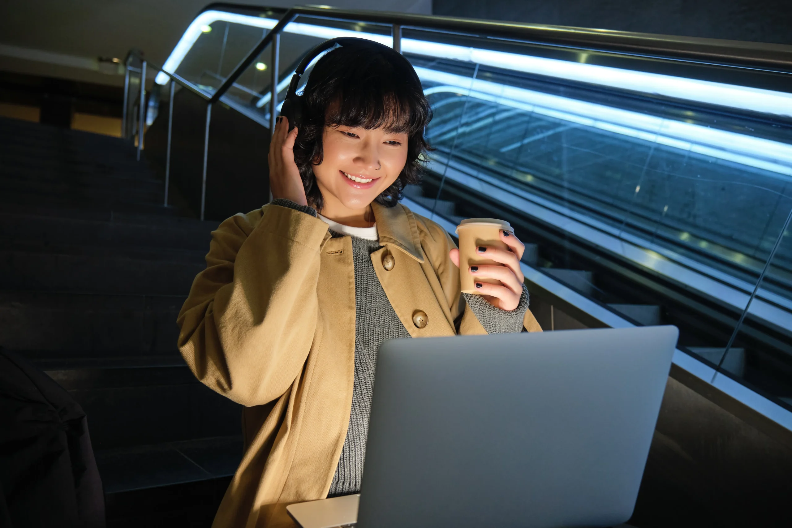 beautiful-young-girl-student-korean-woman-sits-staircase-watches-video-laptop-headphones-dr